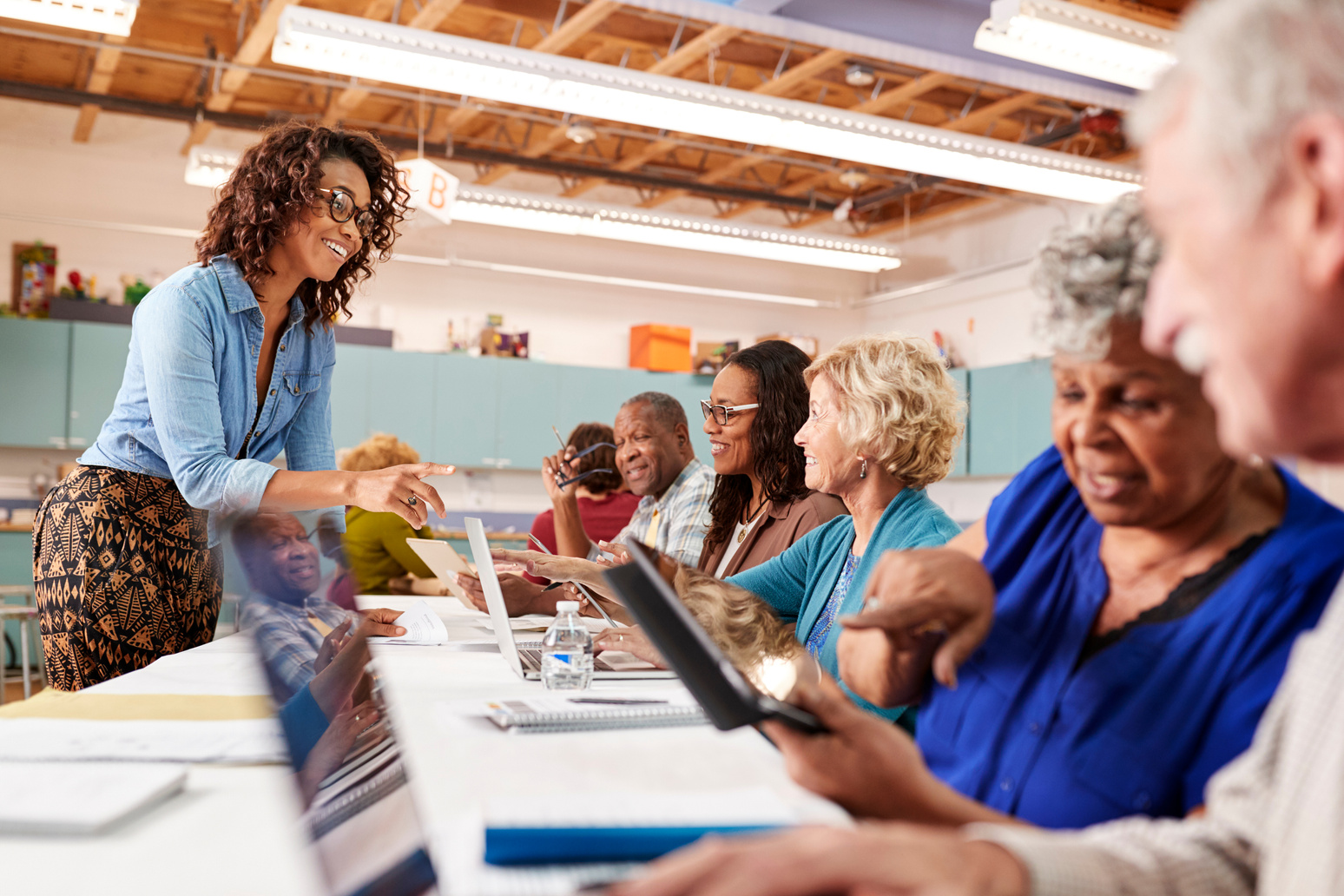 Group of Retired Seniors Attending IT Class in Community Centre